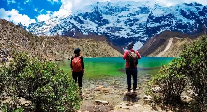visitors to the crystal-clear humantay lagoon