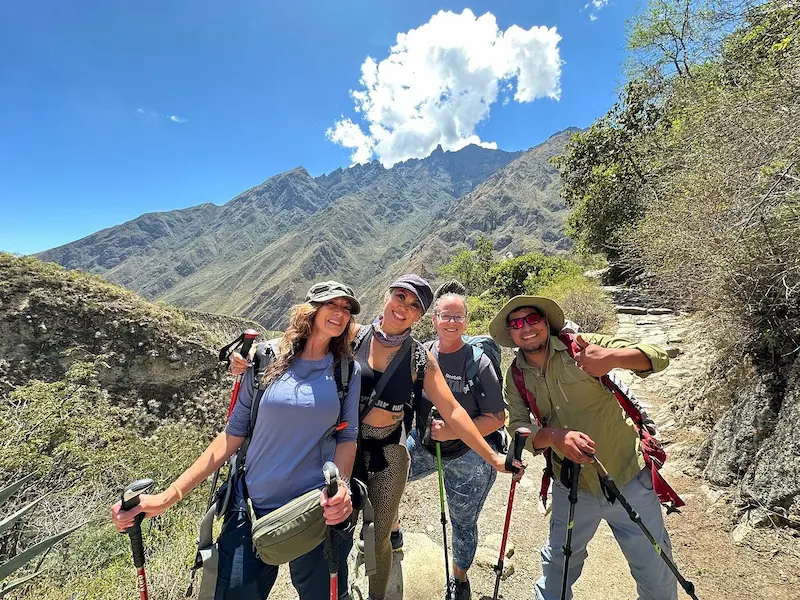 Hikers crossing an ancient Inca bridge on the second day of the Inca Trail